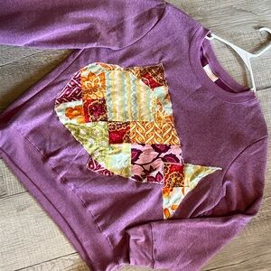 Purple Sweatshirt with Colorful Patchwork Design
